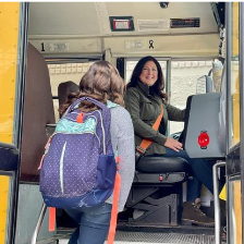  Bus Driver Welcoming Student on Bus